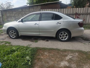 Другие автомобили: Серебристый седан Toyota Premio. Автомобиль оснащен четырьмя дверями — 7