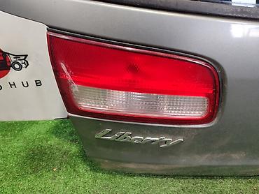 liberty: Фонарь крышки багажника NISSAN LIBERTY M12 2 1998 лев. (б/у) — 1