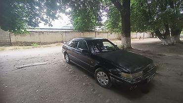 50 55: Mazda 626: 1990 г., Седан — 2