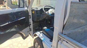 авто телега: Белый грузовой автомобиль Daewoo Labo Deluxe с открытым кузовом
