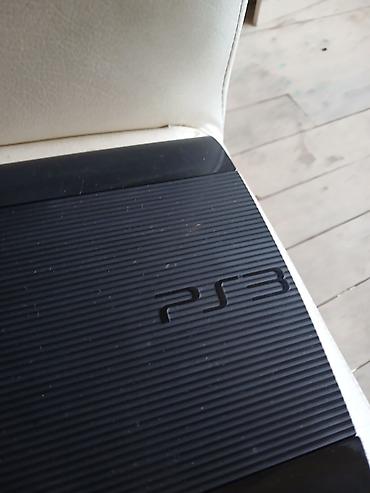 playstation icarəsi: Sony PlayStation 3 (PS3) oyun konsolu. Şəkillərdə qara rəngli PS3 — 2
