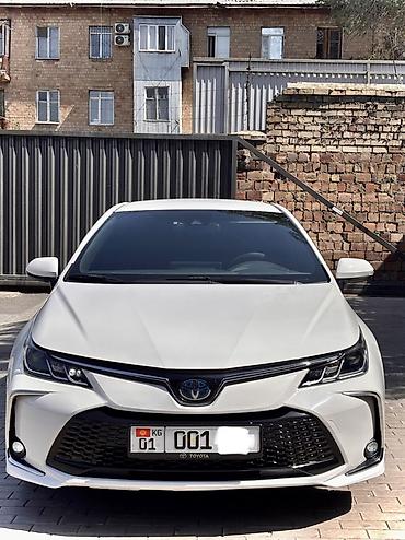 eado ev: Toyota Corolla: 2021 г., 1.8 л, Вариатор, Гибрид, Седан — 2