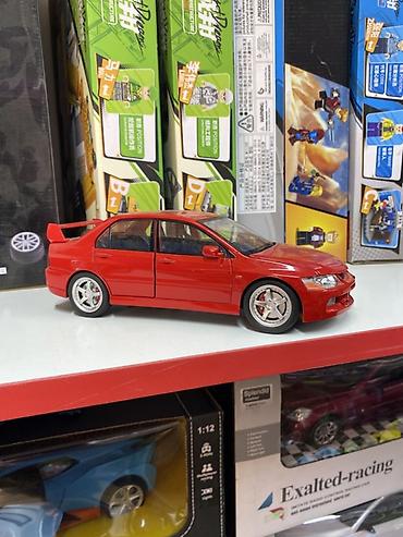 митси бутси: Коллекционная модель автомобиля Mitsubishi Lancer Evolution в красном — 2