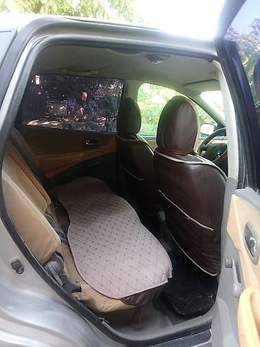 тонировка стекл: Nissan Almera Tino: 2000 г., Механика, Минивэн — 5