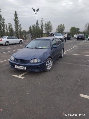 меняю на недвижимость: Седан Toyota Avensis тёмно-синего цвета, оснащенный литыми дисками