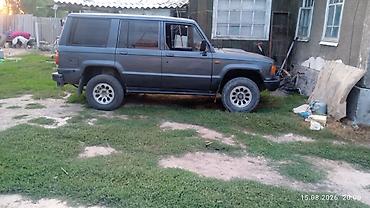 тунуке бу: Isuzu Trooper: 1991 г., 2.3 л, Кол менен иштөөчү, Дизель, Жол тандабас — 5