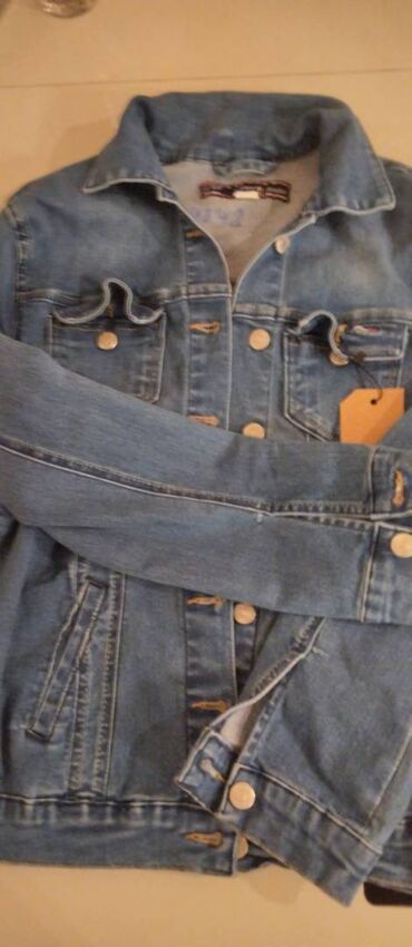 tommy jeans jakna: Teksas jaknica Tommy Hilfiger. Veličina Evropska: 40 Veličina USA: M