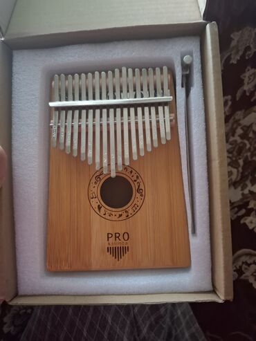 akustik gitara satisi: PRO Kalimba – 17 dillikli, rezonans dəlikli modellərdən. - Korpus