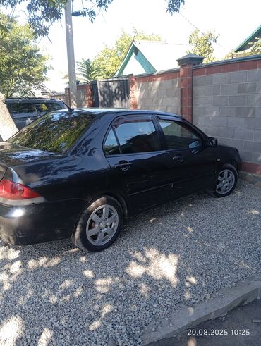 Mitsubishi: Mitsubishi Lancer: 2009 г., 1.6 л, Механика, Бензин, Седан