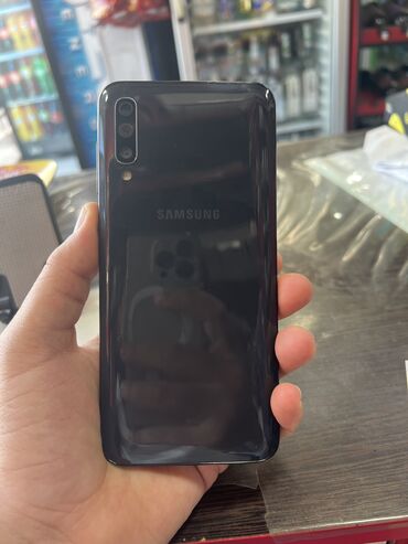 Samsung: Samsung Galaxy A50, 64 GB, rəng - Qara, Barmaq izi, İki sim kartlı, Face ID