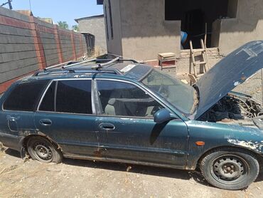 Другие детали кузова: Универсал Mitsubishi Lancer, модель пятого поколения, в темно-зеленом — 6