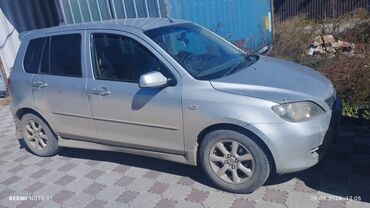 автомобили 07: Mazda Demio: 2002 г., 1.3 л, Автомат, Бензин, Седан