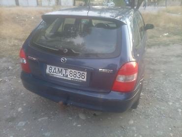 губа 211: Mazda 323: 2000 г., Механика, Бензин — 2