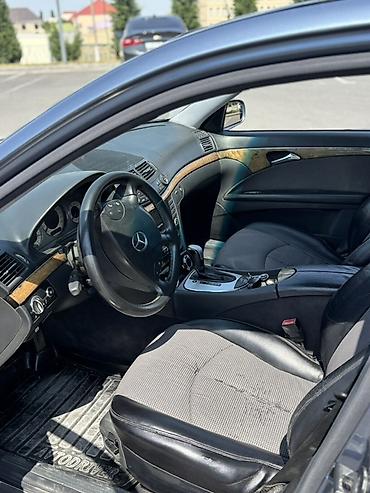 cls 63 amg: Mercedes-Benz E 200: 2 l | 2004 il Sedan — 9