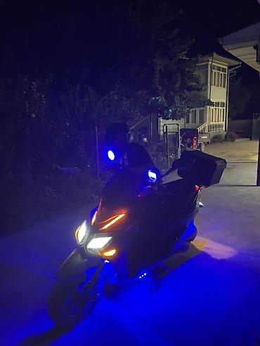 255 50 18: Скутер/мопед с яркой LED‑подсветкой - Агрессивный дизайн передней — 3
