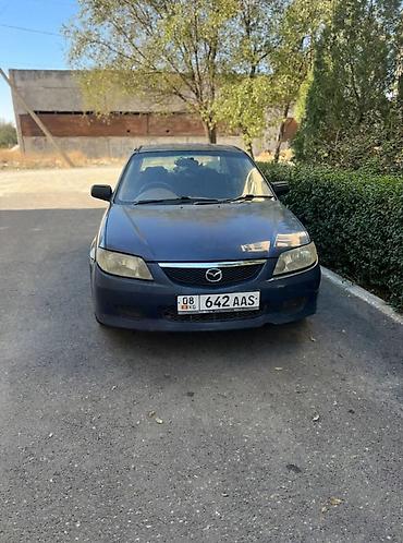 ua 705: Mazda Familia: 2002 г., Автомат, Бензин, Седан — 5