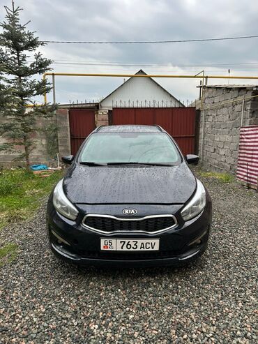 Kia: Автомобиль Kia Ceed SW в кузове универсал. Цвет кузова тёмный