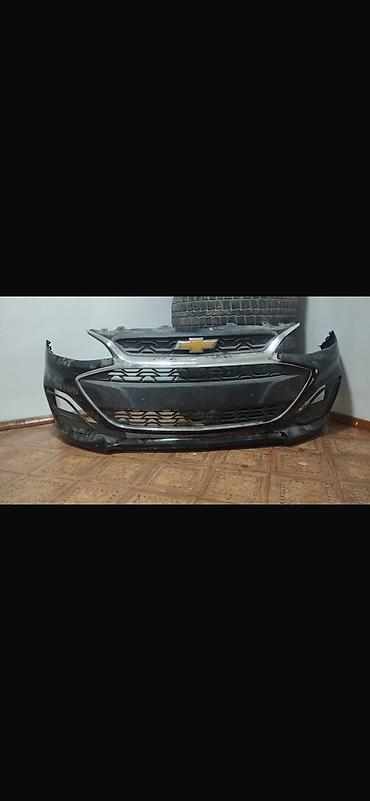 Передний бампер Chevrolet spark (J300/J400, рестайлинг). Оригинал с