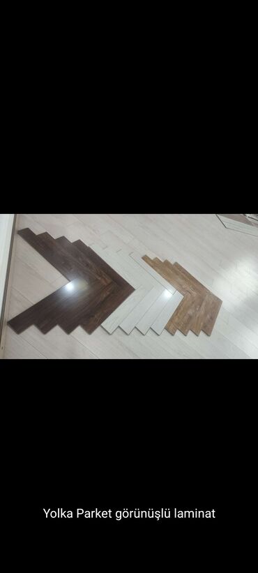 Laminat: Yüksək keyfiyyətli laminat parket, müxtəlif rəng və dizaynlarda
