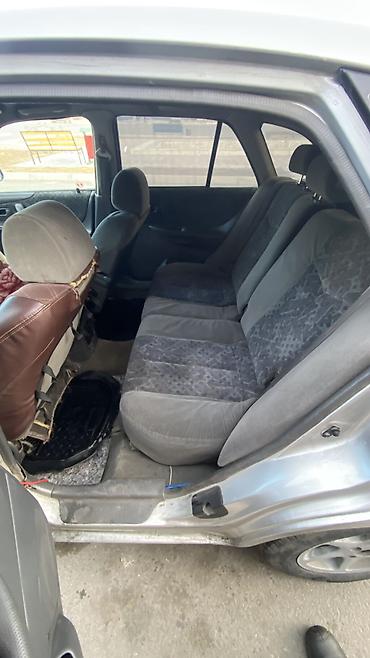 Mazda: Mazda 323: 1998 г. — 8