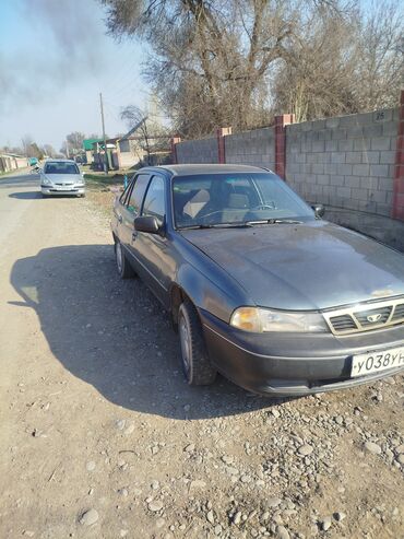 купить двигатель на мотоцикл минск бу: Автомобиль Daewoo Nexia в кузове седан, выполненный в темно-сером