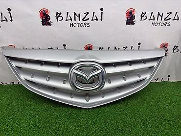 mazda 2000: Решетка радиатора Mazda 2004 г., Б/у, Оригинал — 3