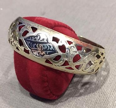 Серебряные браслеты: Серебряный браслет с позолотой с ажурным орнаментом. В центре браслета — 6