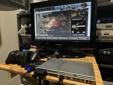 pleşteşin: Playstation 2 Silver 500GB Yaddaşında 250 oyun (həm PS1 həm PS2) var