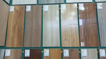 Laminat: Laminat döşəmə panelləri – müxtəlif rəng və teksturalarda taxta