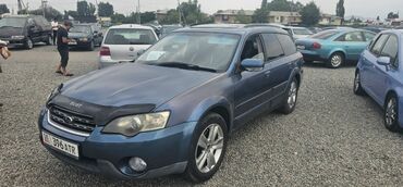 субару импреза универсал: Универсал Subaru Outback синего цвета, оснащенный рейлингами на крыше