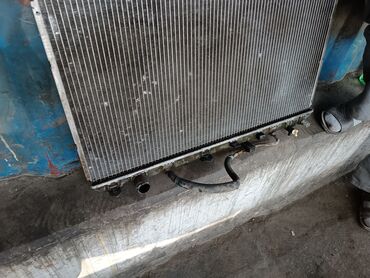 Радиаторы: Радиатор на виндом 21 кузов оригинал нижний бачок трестнут