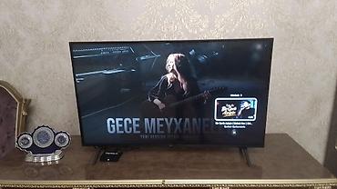 televizor ekran qoruyucu: Smart TV – təxminən 43–50 düym, nazik çərçivəli və incə korpuslu — 1