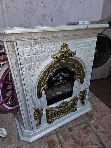 Dekorativ elektrik kamin. Korpus klassik üslubda hazırlanıb, ağ rəngli lalafo.az -da Dekorativ elektrik kamin. Korpus klassik üslubda hazırlanıb, ağ rəngli