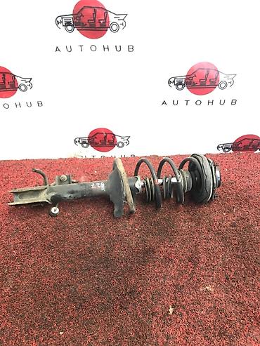 Передний амортизатор Nissan 2000 г., Б/у, Оригинал