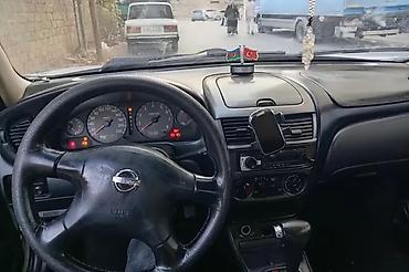 4 göz maşın: Nissan Sunny: 1.6 l | 2004 il Sedan — 7
