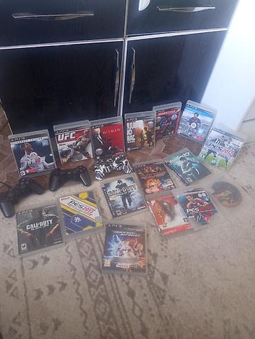 PS3 (Sony PlayStation 3): Игровая консоль Sony PlayStation 3 (модель Slim) с набором дисков — 16