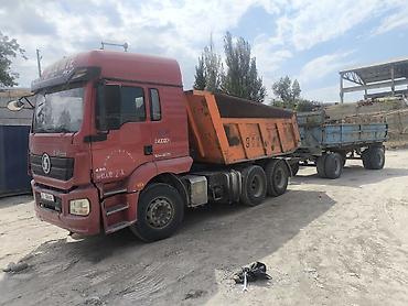 Самосвальный автопоезд для перевозки сыпучих материалов. Состав: -