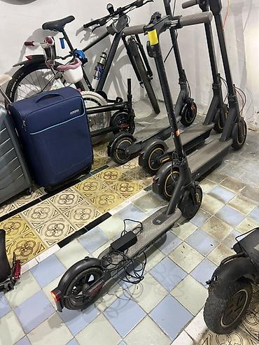 электросамокат бу: Elektrikli skuter. Şəkillərdə qara rəngli, iri təkərli elektrikli — 7