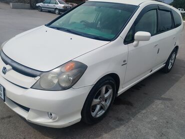 срочно продаю хонда стрим: Белый минивэн Honda Stream, подходящий для семейных поездок и