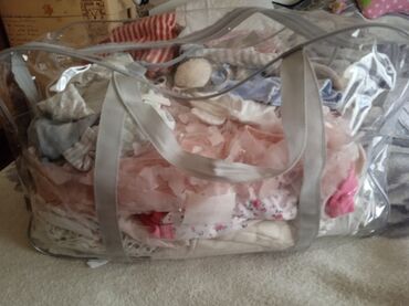 Другие детские вещи: Меняю большую сумку с детскими вещами на две большие пачки подгузников