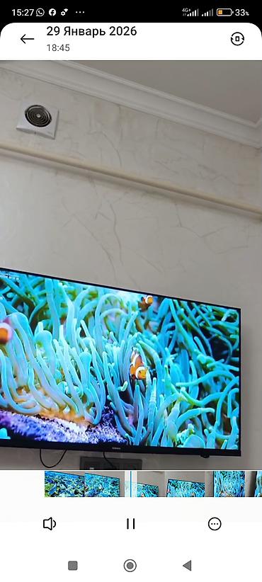 Телевизоры: Телевизор KIVI (надпись на рамке) с тонкими рамками, настенное — 9