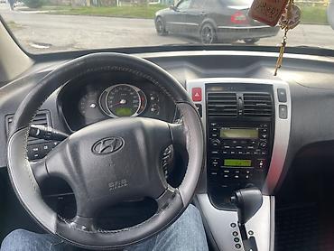 Hyundai: Hyundai Tucson: 2 l | 2005 il Krossover — 6