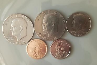 Sikkələr: ABŞ xatirə sikkələri dəsti Tərkib: - 2 ədəd Eisenhower One Dollar — 3