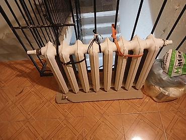 çuqun radiator: Döküm radiator – 7 bölməli, klassik M-çevrəli model. Su əsaslı mərkəzi — 1