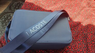 Другая мужская одежда: Продаю барсетку Lacoste новое носил 2-3 раза и то не долго
