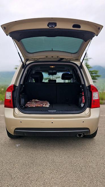 nev holand: Kia Carens: 2 l | 2007 il Van/Minivan — 4