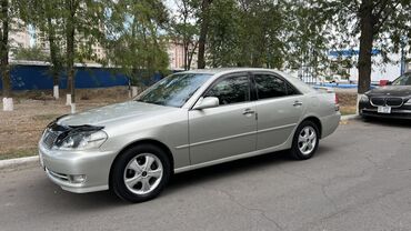 марк ii: Элегантный седан Toyota Mark II серебристого цвета, представленный на