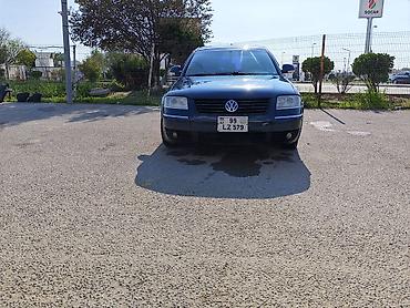changan disk: Volkswagen Passat sedan. Avtomobil tünd göy rəngdədir və klassik — 8