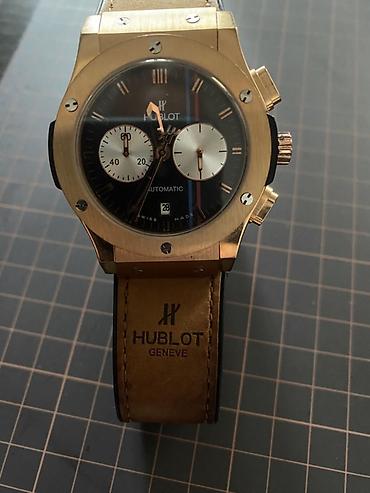 saat alanlar: İşlənmiş, Qol saatı, Hublot, rəng - Qızılı — 2