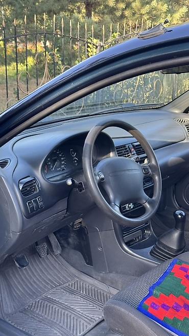 140 280: Mazda 323: 1996 г., 1.4 л, Механика, Бензин, Хэтчбэк — 7